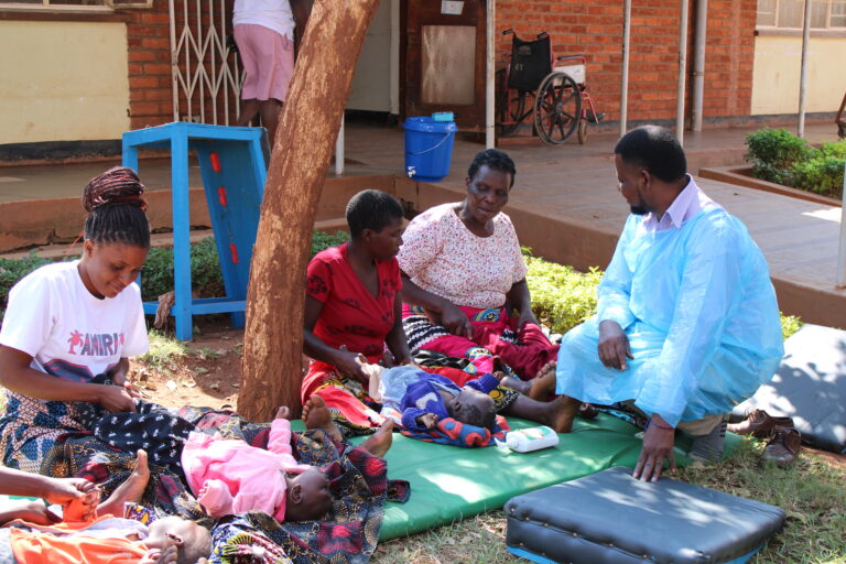 SJOG staff interacting with clients