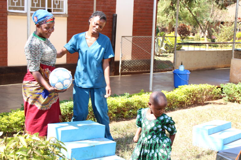 SJOG staff interacting with clients